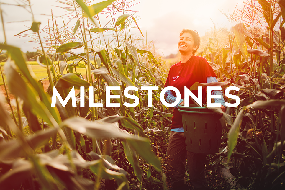 Image of a girl smiling in a cornfield holding a planter